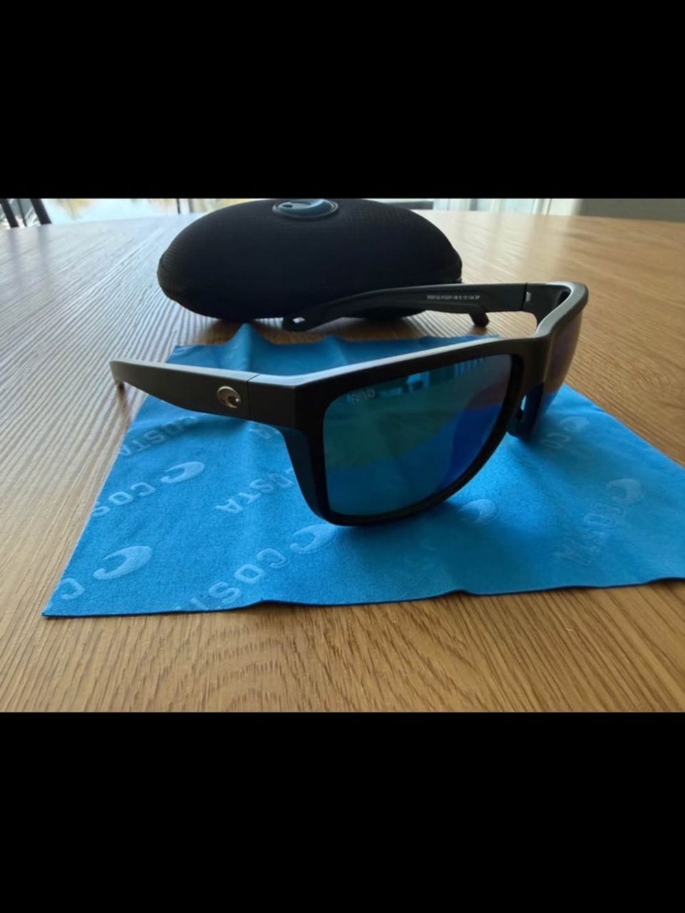 Costa Sunglasses in Black with Blue Lenses
